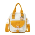 Petit sac bandoulière en toile pour femme au design bicolore blanc et jaune avec badge mignon - Jaune