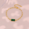 Detail of gold paperclip chain bracelet featuring a rectangular green malachite stone - Bracelet