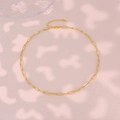 Macro shot of gold paperclip chain necklace with lobster clasp and extension links - Paperclip Chain Necklace