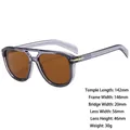 Retro round sunglasses with translucent grey frames, brown lenses, and gold accents - Z3682 Transparent Gray Tea Lens