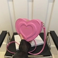 Pink heart-shaped crossbody bag with embossed texture and gold zipper detail - Pink