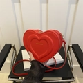Red heart shaped crossbody bag with layered PU leather design and golden hardware - Red