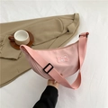 Pink crescent moon crossbody bag with adjustable wide strap and minimalist logo patch - Pink