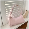 Detail of pink crocodile embossed leather shoulder bag with decorative knotted strap - 721 Pink