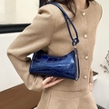 Detail view of navy blue faux crocodile leather shoulder bag with glossy finish and knot strap - 627 Blue
