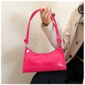 Detail of fuchsia crocodile pattern leather shoulder bag with decorative knotted strap - 627 Fuchsia