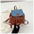 Detail of mini backpack featuring brown PU leather and blue denim contrast with drawstring - Blue and Brown