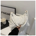 White quilted hobo shoulder bag featuring minimalist diamond pattern and golden hardware - White