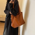 Minimalist caramel brown PU leather tote bag with vertical stitching for daily commute - Tan