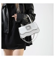 Detail of white wavy leather bag with crystal buckle and elegant metal handle - White
