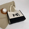 Grand sac cabas en toile bicolore noir et blanc avec motif imprimé M artistique - Blanc Cassé