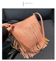 Detail view of the pink fringe shoulder bag featuring premium lychee grain leather texture - Pink