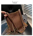 Close-up of brown fringe crossbody phone bag featuring pebbled leather texture - Tan
