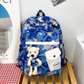Blue and gray camouflage student backpack with a cute plush bear charm for school - Blue