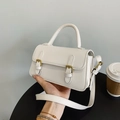 Women's minimalist cream crossbody bag with vintage gold metal buckles and top handle - White