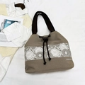 Minimalist khaki canvas bucket bag featuring floral lace print and drawstring closure - Khaki
