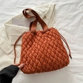 Quilted caramel tote bag with drawstring closure and matching wide shoulder strap - Brown
