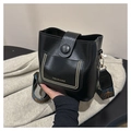 Detail of black PU leather bucket bag with gold accents and colorful jacquard strap - Without Pendant / Black