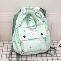 Light green drawstring backpack featuring cute white bunny cartoons and multiple pockets - Light Green Rabbit