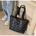 Glossy black quilted tote bag with diamond pattern and long handles for shoulder use - Black
