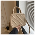 Detail of beige quilted crossbody bag featuring a golden metal hook and top handle - Khaki