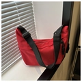 Minimalist red dumpling crossbody bag with adjustable wide black shoulder strap and zipper - Red