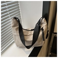 Minimalist beige dumpling shoulder bag with wide black strap and zipper detail - Khaki