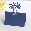 Dark blue laser-cut place card with tropical coconut tree design for beach weddings - Sapphire Blue