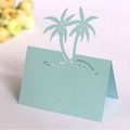 Light blue tent-style place card with laser-cut coconut trees for weddings - Light Blue