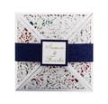 Detail of laser-cut floral patterns on white pearlescent paper wedding invitation - Laser Cut Cover With Navy Blue Glitter Belly Band