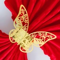 Golden butterfly napkin ring with hollow floral patterns on red napkin for weddings - Reflective Gold