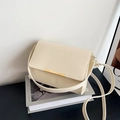 Minimalist cream white shoulder bag with crinkled texture and golden metal buckle - White