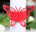 Macro detail of laser-cut red butterfly napkin ring for wedding and party decoration - Pearlescent Red