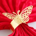Exquisite gold butterfly napkin ring with laser-cut hollow design on red fabric background - Reflective Gold