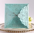 Detail of laser-cut tiffany blue invitation card with floral lace on a porcelain plate - Tiffany Blue