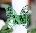 Green laser-cut butterfly napkin ring with heart pattern for wedding table decor - Reflective Green