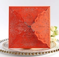 Detail of laser-cut red invitation card with intricate mandala floral patterns - Orange Red