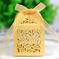 Elegant gold hollow laser cut wedding candy box with shiny pearl finish and gold ribbon - Gold