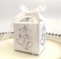 White laser cut Ganesha gift box with organza ribbon on a white ceramic tray - White