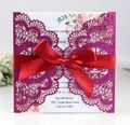Elegant laser-cut purple glitter wedding invitation with a red satin ribbon bow - Glitter Fuchsia