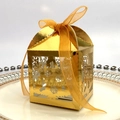 Elegant gold laser-cut Christmas candy box with snowflake reindeer patterns and ribbon - Reflective Gold