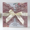 Laser cut rose gold glitter wedding invitation with off-white ribbon and floral insert - Glitter Pink