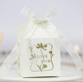White laser-cut candy box with 'LOVE YOU' floral pattern and white ribbon bow - Ivory