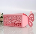 Pink laser-cut candy box with rose hollow patterns and elegant butterfly closure - Pink
