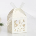 White laser-cut angel candy box with intricate hollow patterns and silk ribbon bow - Ivory