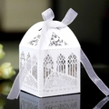 Laser cut church pattern white wedding favor box with ribbon on reflective black background - White