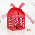 Elegant red laser-cut candy gift box with hollow circles and a decorative silk ribbon - Pearlescent Red