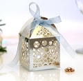 Elegant silver laser-cut candy box with circular patterns and a light blue silk ribbon bow - Reflective Silver