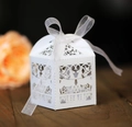 Elegant white laser-cut Christmas reindeer candy box with a matching white ribbon bow - White