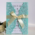 Laser cut mint green wedding invitation with elegant ribbon and floral detail - Tiffany Blue